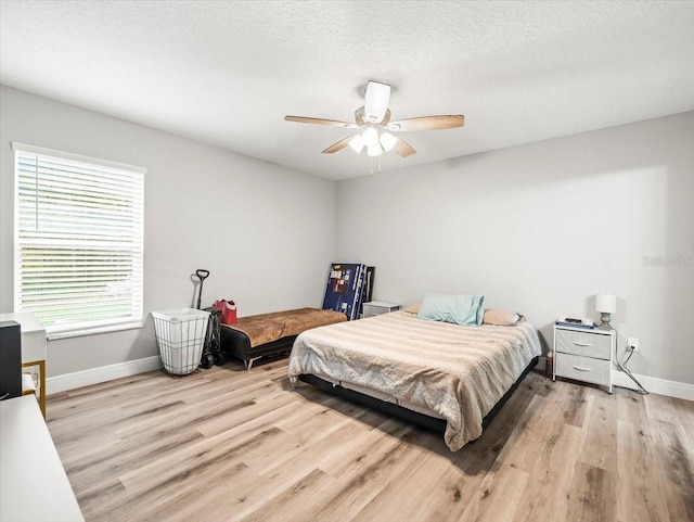 8737 N Spikes Way, Dunnellon, FL 34434 - bedroom with wood finished floors and a ceiling fan