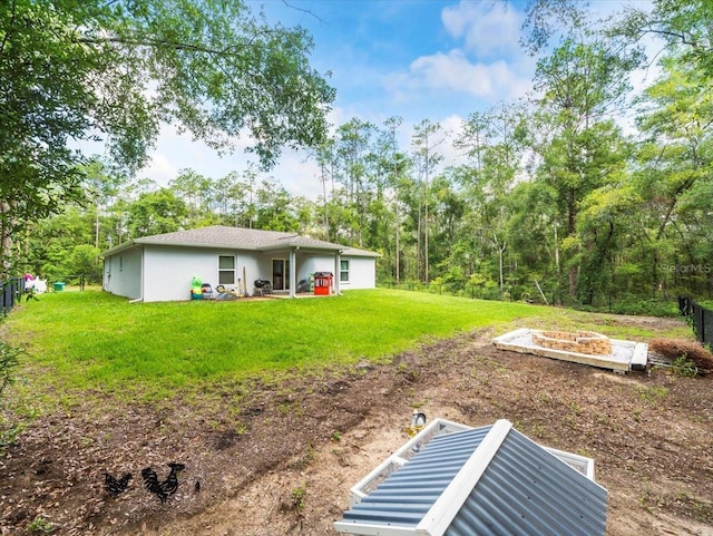 8737 N Spikes Way, Dunnellon, FL 34434 - view of yard featuring a fire pit