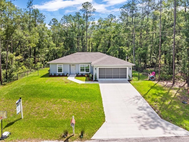 8737 N Spikes Way, Dunnellon, FL 34434 - ranch-style house featuring an attached garage, driveway, stucco siding, a wooded view, and a shingled roof