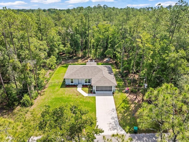 8737 N Spikes Way, Dunnellon, FL 34434 - aerial view of property and surrounding area featuring a heavily wooded area