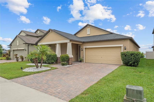 11308 Chilly Water Ct, Riverview, FL 33569 - view of front of house with an attached garage, a front yard, and stucco siding