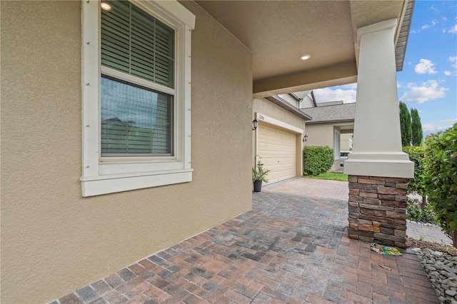 11308 Chilly Water Ct, Riverview, FL 33569 - view of patio with a garage and driveway