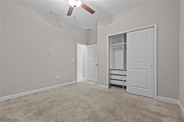 11308 Chilly Water Ct, Riverview, FL 33569 - unfurnished bedroom with carpet, a textured ceiling, a closet, and ceiling fan