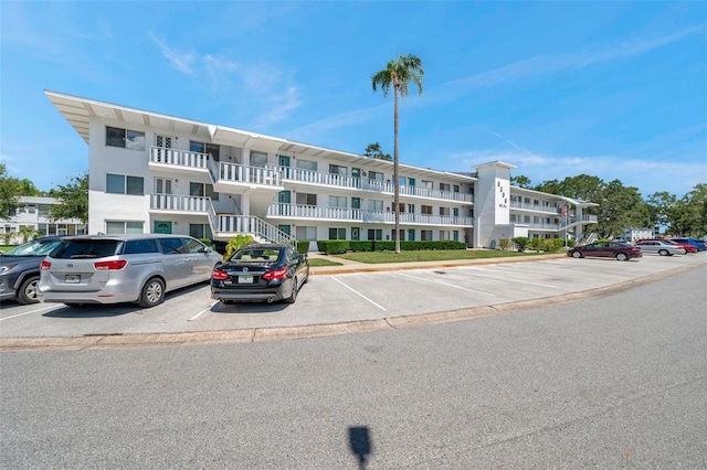 8396 111th St Unit 301, Seminole, FL 33772 - view of apartment building / complex featuring uncovered parking