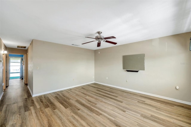 8396 111th St Unit 301, Seminole, FL 33772 - empty room featuring light wood finished floors and ceiling fan