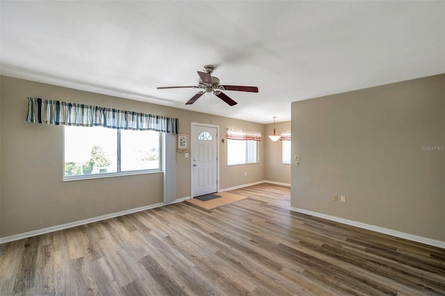 8396 111th St Unit 301, Seminole, FL 33772 - foyer with wood finished floors and a ceiling fan