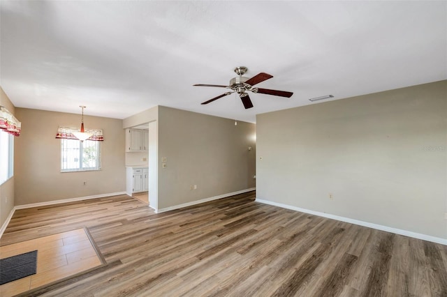 8396 111th St Unit 301, Seminole, FL 33772 - spare room with light wood-style floors and a ceiling fan