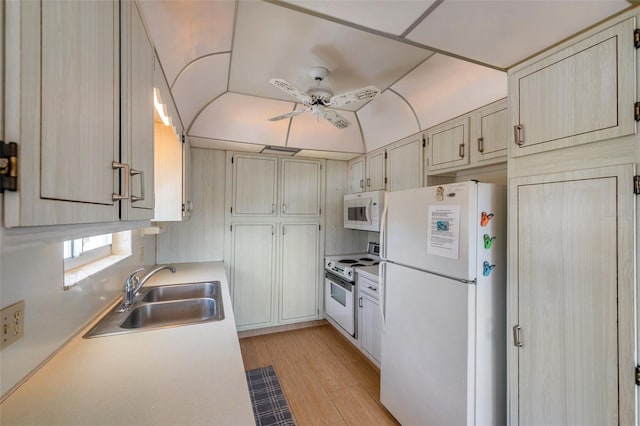 8396 111th St Unit 301, Seminole, FL 33772 - kitchen featuring white appliances, ceiling fan, light wood-style floors, light countertops, and lofted ceiling
