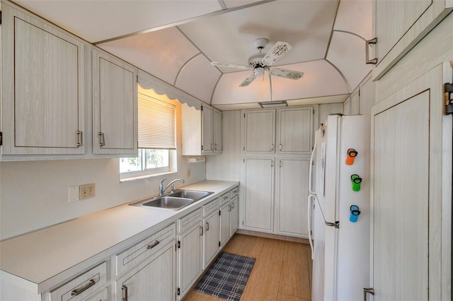 8396 111th St Unit 301, Seminole, FL 33772 - kitchen featuring freestanding refrigerator, light countertops, ceiling fan, light wood-type flooring, and vaulted ceiling