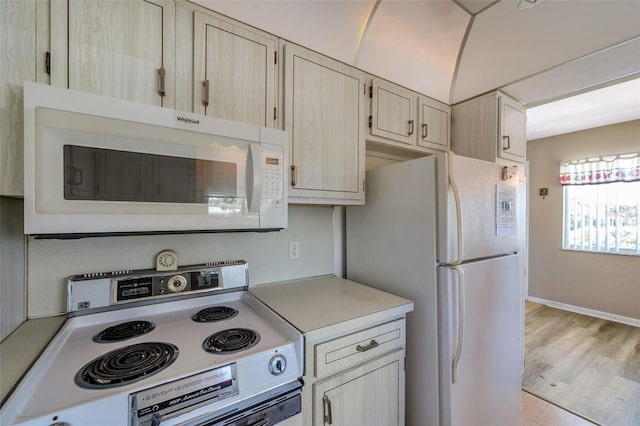 8396 111th St Unit 301, Seminole, FL 33772 - kitchen featuring white appliances and light countertops