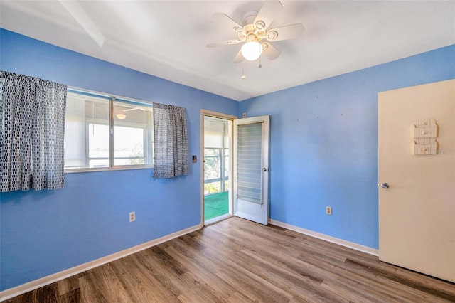 8396 111th St Unit 301, Seminole, FL 33772 - unfurnished bedroom with wood finished floors, access to outside, and ceiling fan