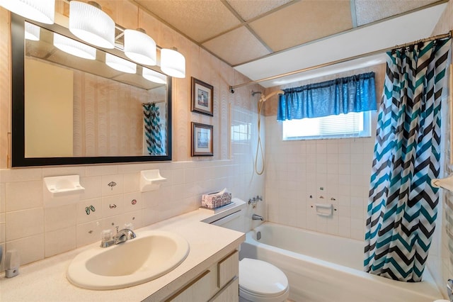 8396 111th St Unit 301, Seminole, FL 33772 - full bathroom featuring vanity, shower / tub combo with curtain, and tile walls