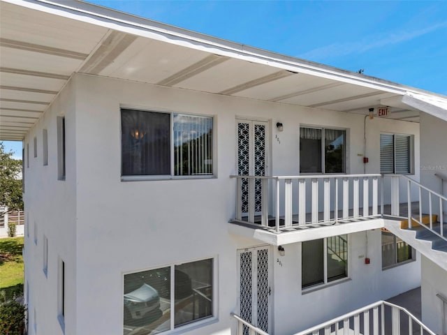 8396 111th St Unit 301, Seminole, FL 33772 - view of side of property featuring a balcony and stucco siding