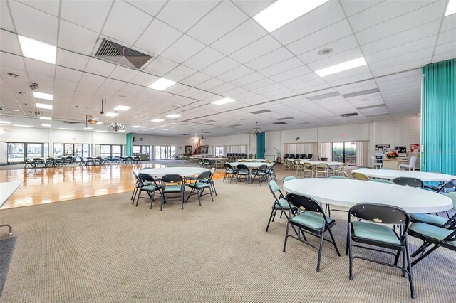 8396 111th St Unit 301, Seminole, FL 33772 - carpeted dining room featuring healthy amount of natural light and a paneled ceiling