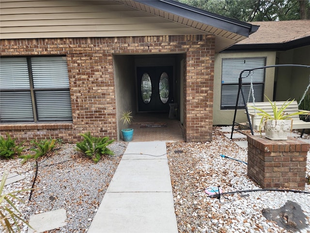 909 Heatherbrook Dr, Auburndale, FL 33823 - entrance to property featuring brick siding