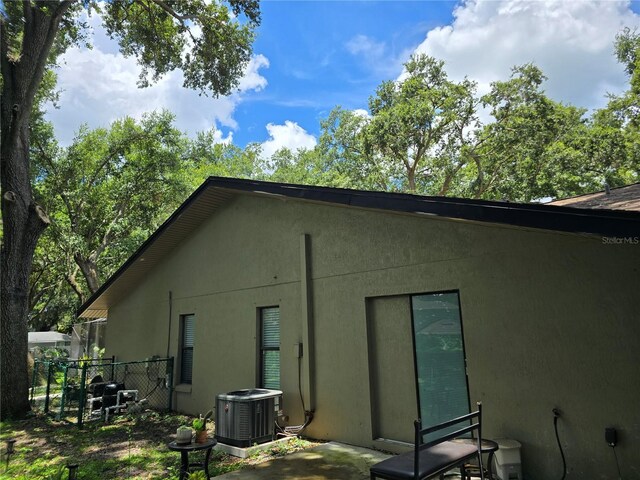 909 Heatherbrook Dr, Auburndale, FL 33823 - rear view of property with stucco siding