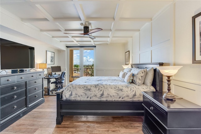 5353 Gulf Blvd Unit A402, St Pete Beach, FL 33706 - bedroom with access to exterior, coffered ceiling, beamed ceiling, wood finished floors, and an office area