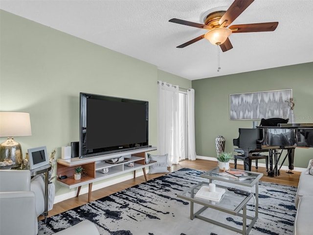 1250 S Pinellas Ave Unit 207, Tarpon Springs, FL 34689 - living area with ceiling fan, a textured ceiling, and wood finished floors