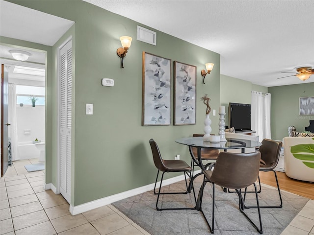 1250 S Pinellas Ave Unit 207, Tarpon Springs, FL 34689 - dining area featuring light tile patterned floors and ceiling fan