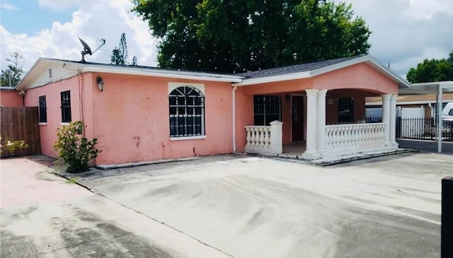4725 Town N Country Blvd, Tampa, FL 33615 - view of front of house with a porch and stucco siding