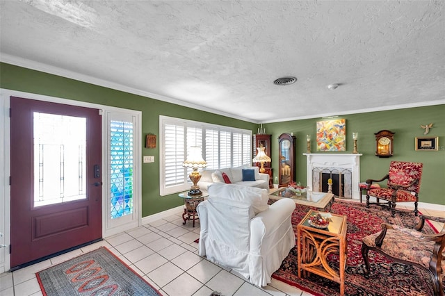 3898 49th Ave S, Saint Petersburg, FL 33711 - living area featuring ornamental molding, a fireplace, light tile patterned floors, and a textured ceiling