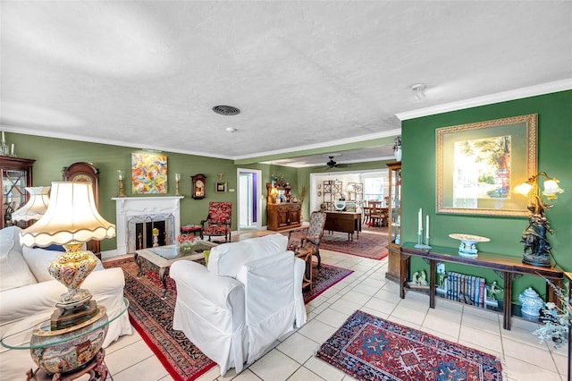 3898 49th Ave S, Saint Petersburg, FL 33711 - living room with a fireplace with raised hearth, ornamental molding, light tile patterned floors, and a ceiling fan