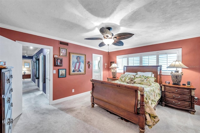 3898 49th Ave S, Saint Petersburg, FL 33711 - bedroom featuring light carpet, ornamental molding, a textured ceiling, a ceiling fan, and ensuite bathroom