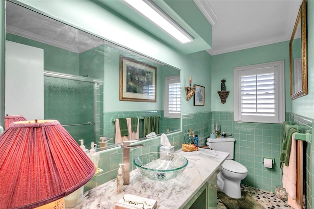 3898 49th Ave S, Saint Petersburg, FL 33711 - bathroom with a stall shower, healthy amount of natural light, tile walls, vanity, and a wainscoted wall