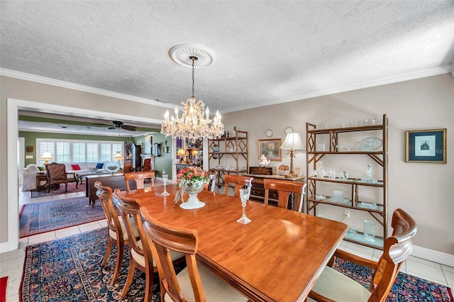 3898 49th Ave S, Saint Petersburg, FL 33711 - tiled dining space with a chandelier, ornamental molding, a ceiling fan, and a textured ceiling