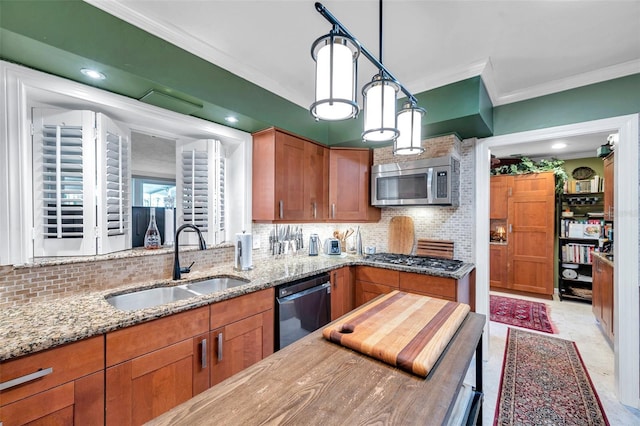 3898 49th Ave S, Saint Petersburg, FL 33711 - kitchen with stainless steel appliances, crown molding, brown cabinets, and backsplash