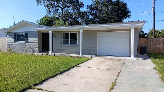 3150 Beacon Square Dr, Holiday, FL 34691 - single story home featuring concrete driveway, stone siding, and an attached garage