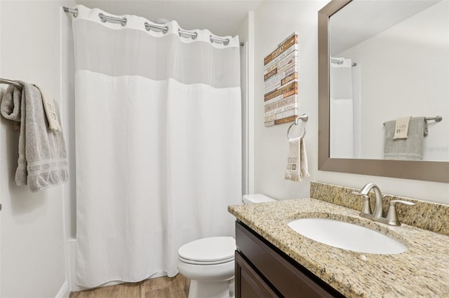 5808 Grand Sonata Ave, Lutz, FL 33558 - bathroom featuring vanity, wood finished floors, and shower / bath combo with shower curtain