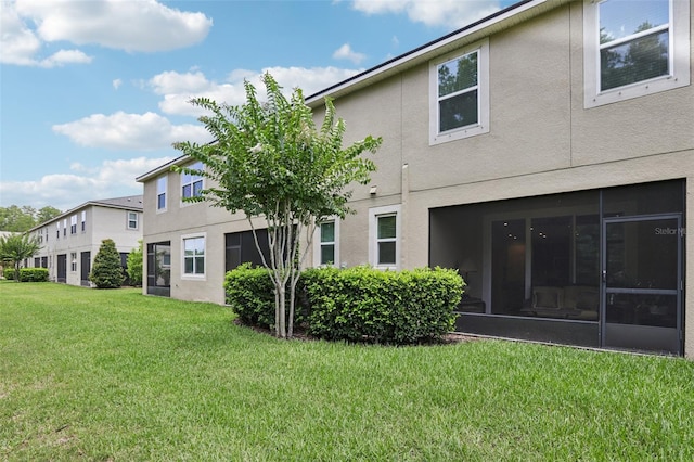 5808 Grand Sonata Ave, Lutz, FL 33558 - back of property featuring a yard and stucco siding