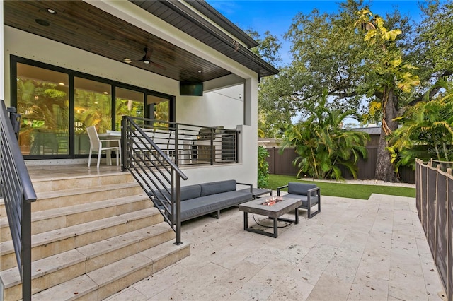 503 W Davis Blvd, Tampa, FL 33606 - fenced backyard with a patio, ceiling fan, and an outdoor living space with a fire pit