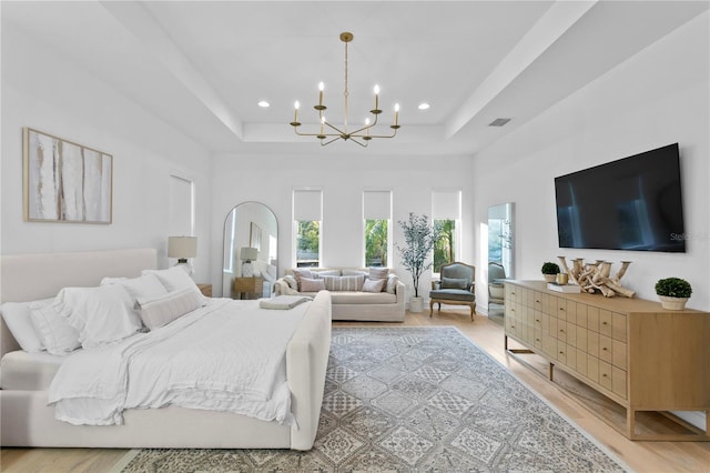 503 W Davis Blvd, Tampa, FL 33606 - bedroom featuring a chandelier, a raised ceiling, recessed lighting, and light wood finished floors