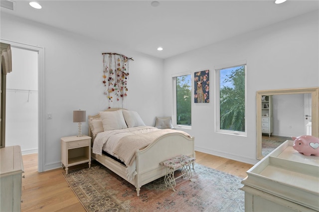 503 W Davis Blvd, Tampa, FL 33606 - bedroom with a spacious closet, light wood-type flooring, recessed lighting, and a closet