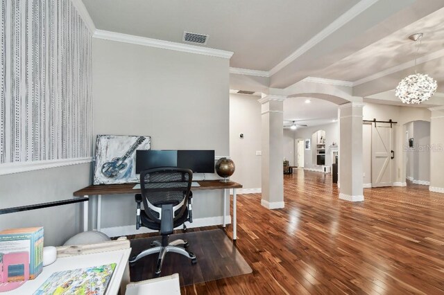 15217 Octavia Ln, Odessa, FL 33556 - home office featuring a barn door, arched walkways, hardwood / wood-style floors, decorative columns, and a ceiling fan