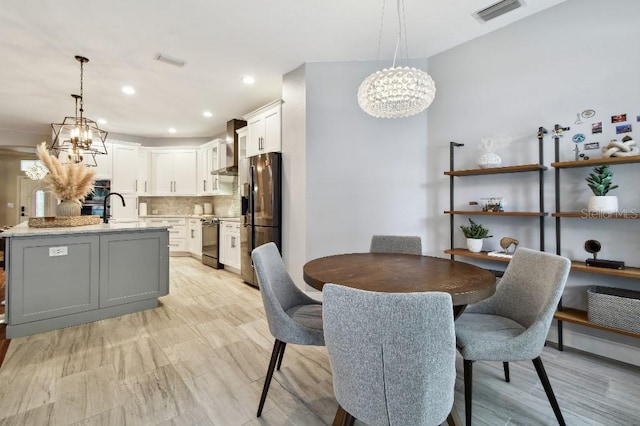 15217 Octavia Ln, Odessa, FL 33556 - dining space with a chandelier and recessed lighting