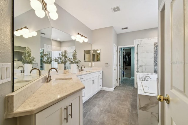 15217 Octavia Ln, Odessa, FL 33556 - full bath featuring vanity, a garden tub, and a spacious closet