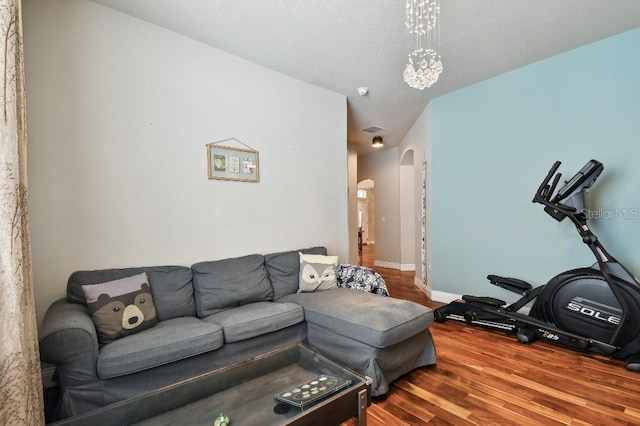 15217 Octavia Ln, Odessa, FL 33556 - living room featuring arched walkways and wood finished floors