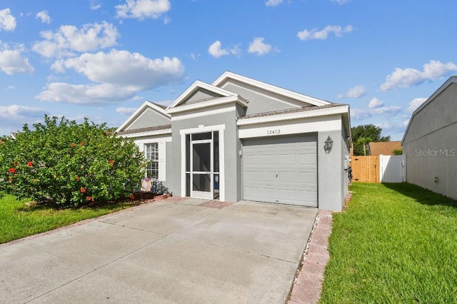 12413 Dawn Vista Dr, Riverview, FL 33578 - view of front of property with stucco siding, driveway, a garage, and a gate