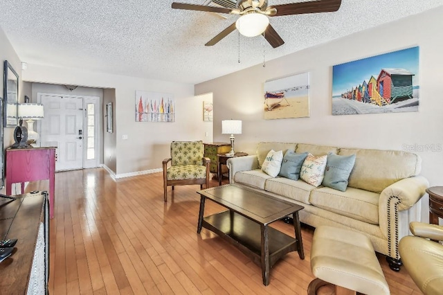 12413 Dawn Vista Dr, Riverview, FL 33578 - living area featuring a textured ceiling, ceiling fan, and light wood-style flooring