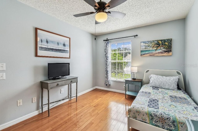 12413 Dawn Vista Dr, Riverview, FL 33578 - bedroom with a textured ceiling, hardwood / wood-style floors, and ceiling fan