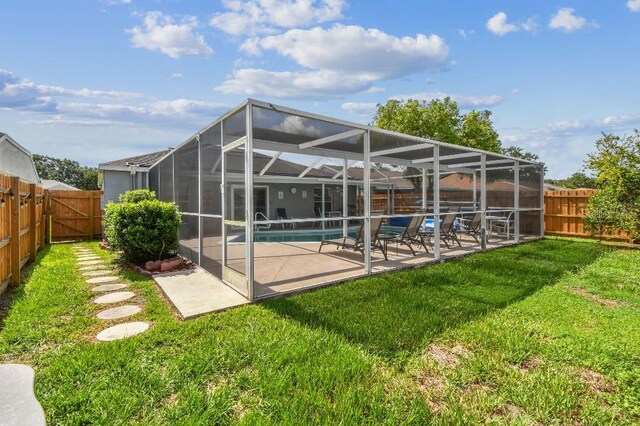 12413 Dawn Vista Dr, Riverview, FL 33578 - back of house with a fenced backyard, a patio area, and a lanai
