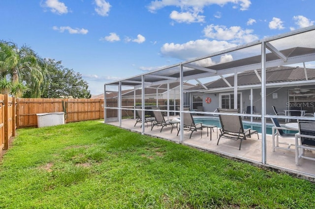 12413 Dawn Vista Dr, Riverview, FL 33578 - rear view of house with a fenced backyard, a patio area, and a lanai
