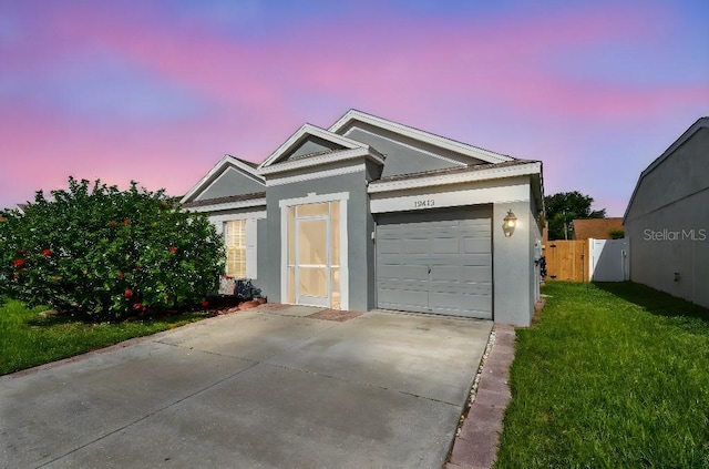 12413 Dawn Vista Dr, Riverview, FL 33578 - view of front of house with stucco siding, driveway, and an attached garage