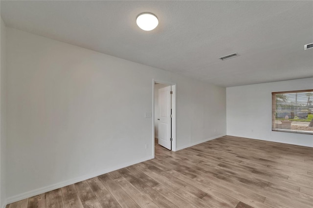 6334 Cocoa Ln, Apollo Beach, FL 33572 - empty room featuring light wood finished floors and baseboards