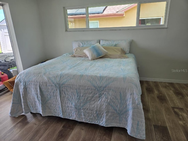 6334 Cocoa Ln, Apollo Beach, FL 33572 - bedroom featuring wood finished floors and baseboards