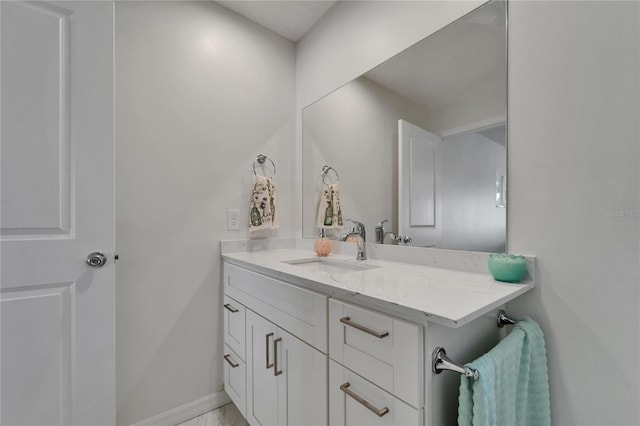 6334 Cocoa Ln, Apollo Beach, FL 33572 - bathroom featuring vanity and baseboards