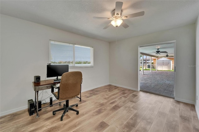 6334 Cocoa Ln, Apollo Beach, FL 33572 - office area featuring ceiling fan, plenty of natural light, light wood finished floors, and a textured ceiling